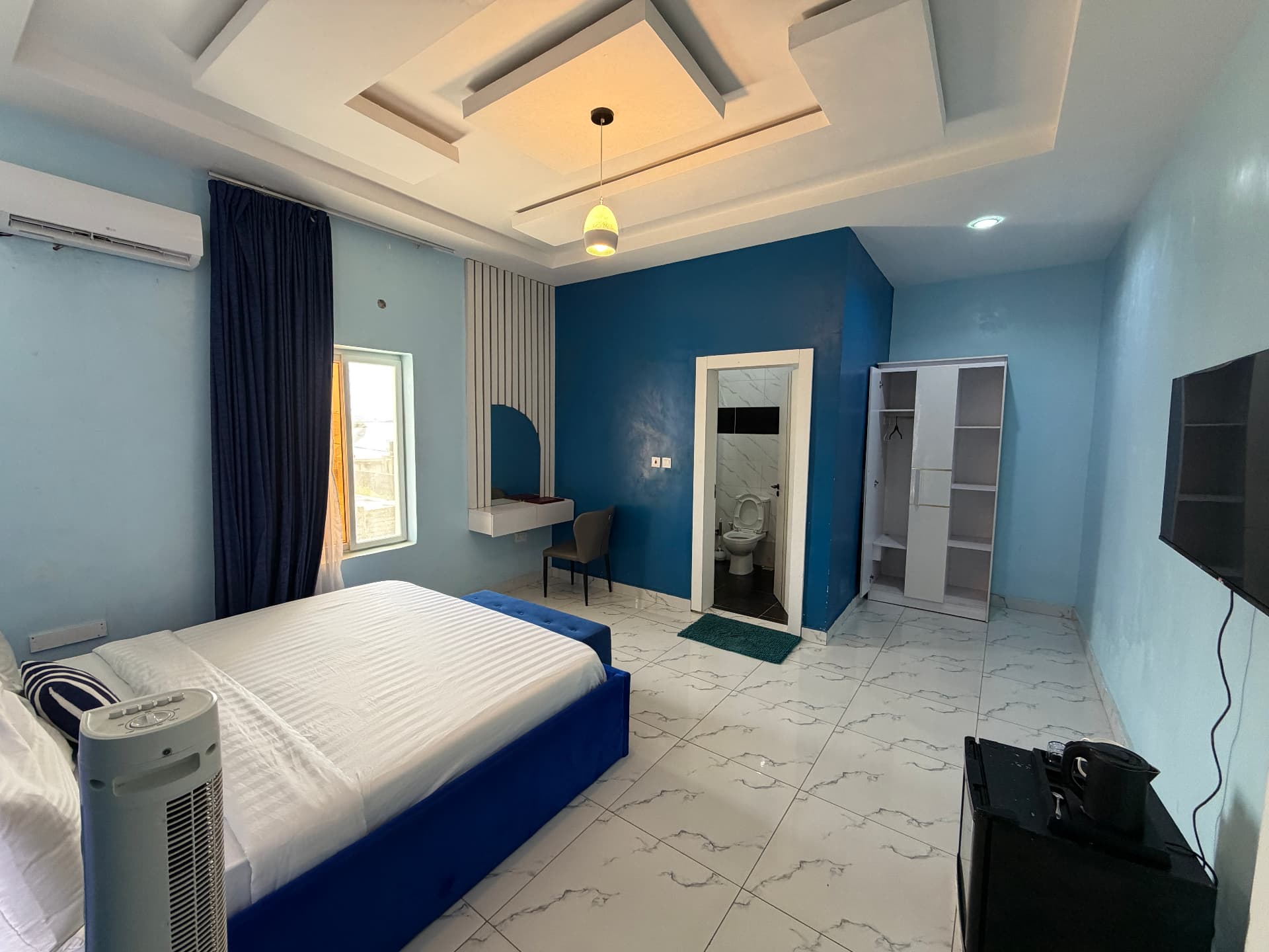 The main bedroom, bathroom off the far wall - Family Suite at Timeless Haven & Cottage, photo 1 of 4